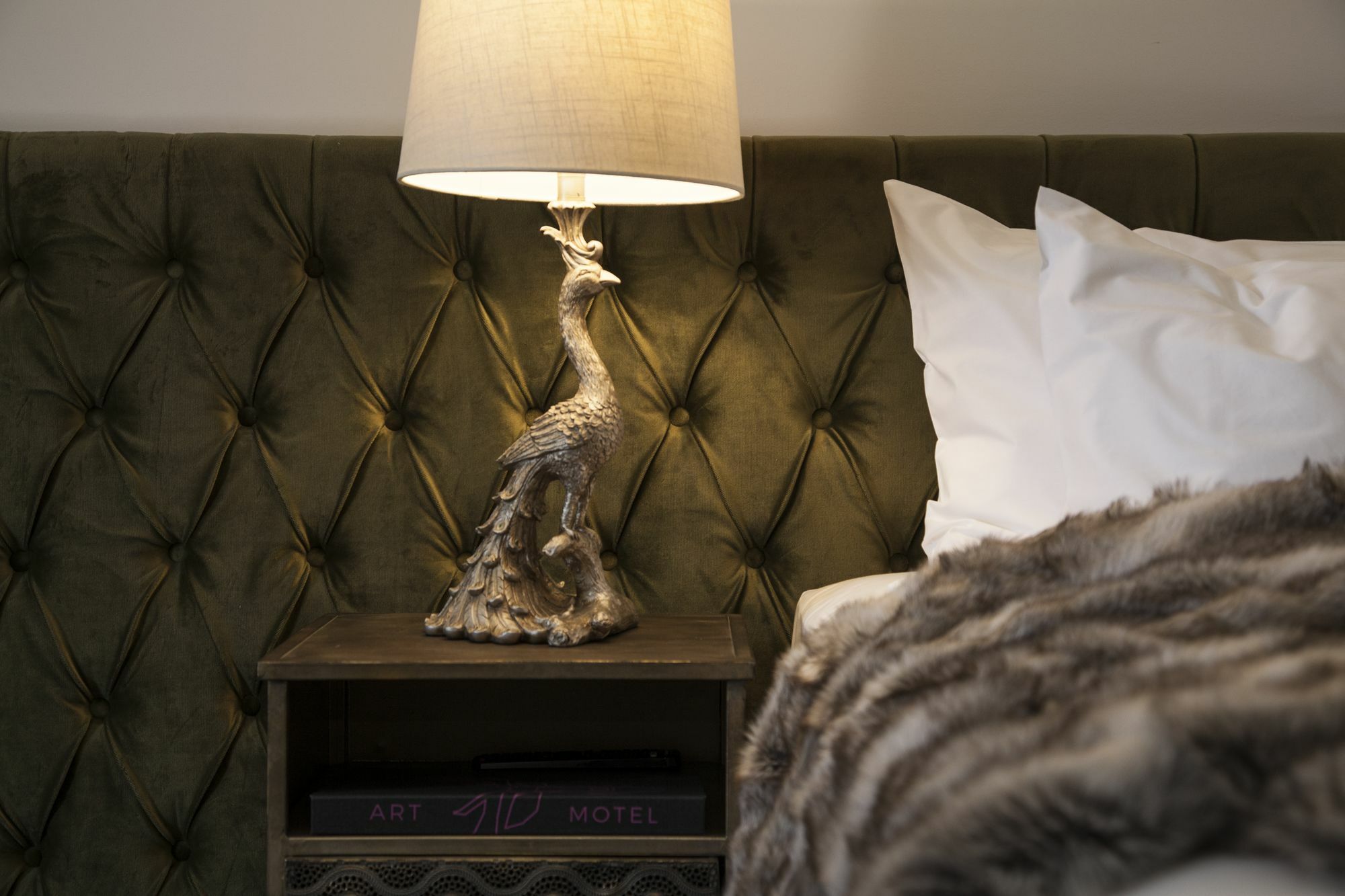 Daylesford Art Motel Exterior photo A bed with a tufted headboard